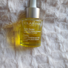 Swatch de Claudiaor : Huile Santal, Clarins